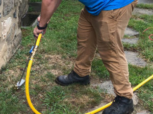 Our technician uses a rod to inject termiticide into the soil and concrete to create a barrier between the home and property.