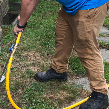 Our technician uses a rod to inject termiticide into the soil and concrete to create a barrier between the home and property.